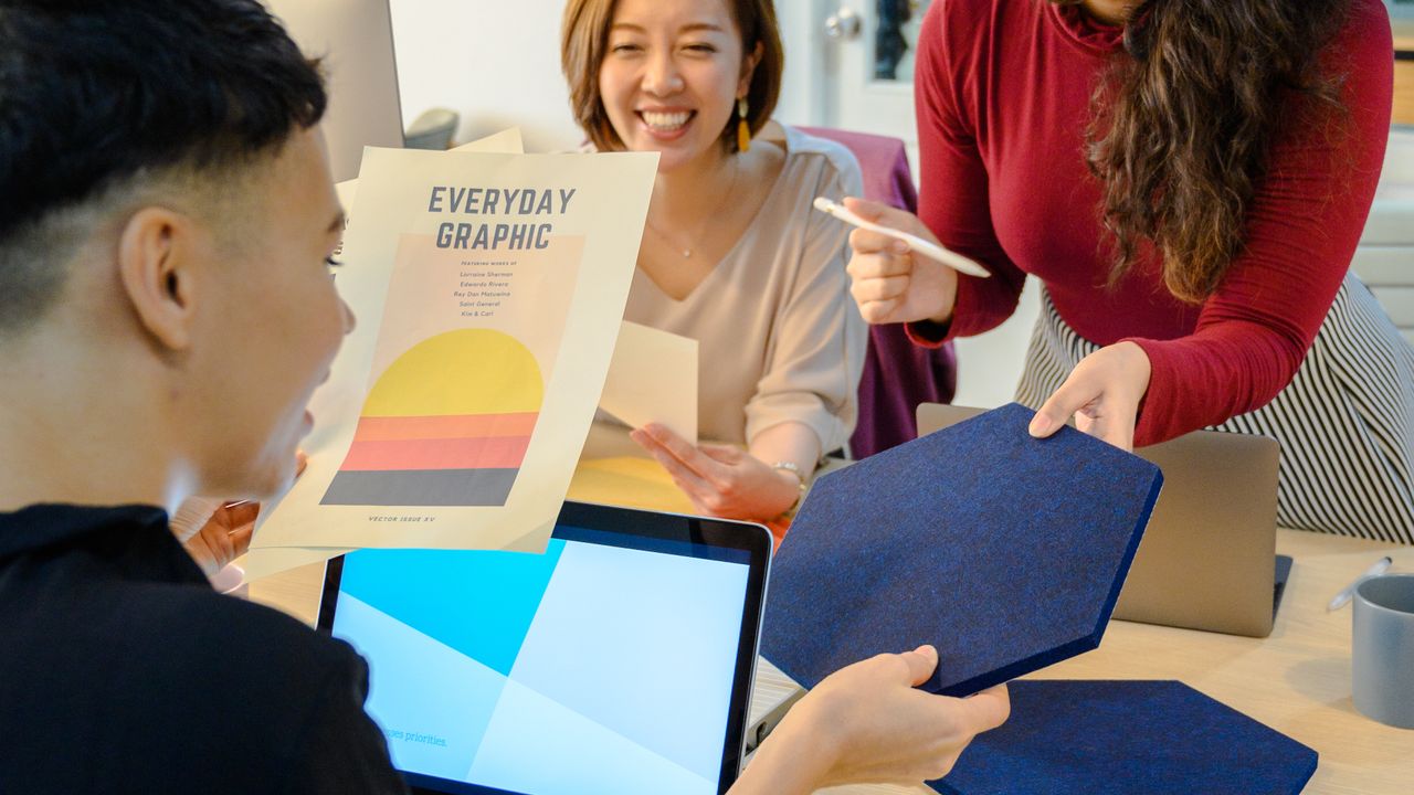 Creative team reviewing a design concept together in a meeting
